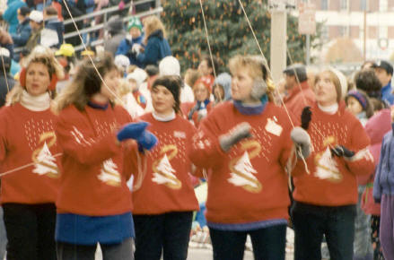 Balloon handers for parade. Show sweatshirts with the parade logo